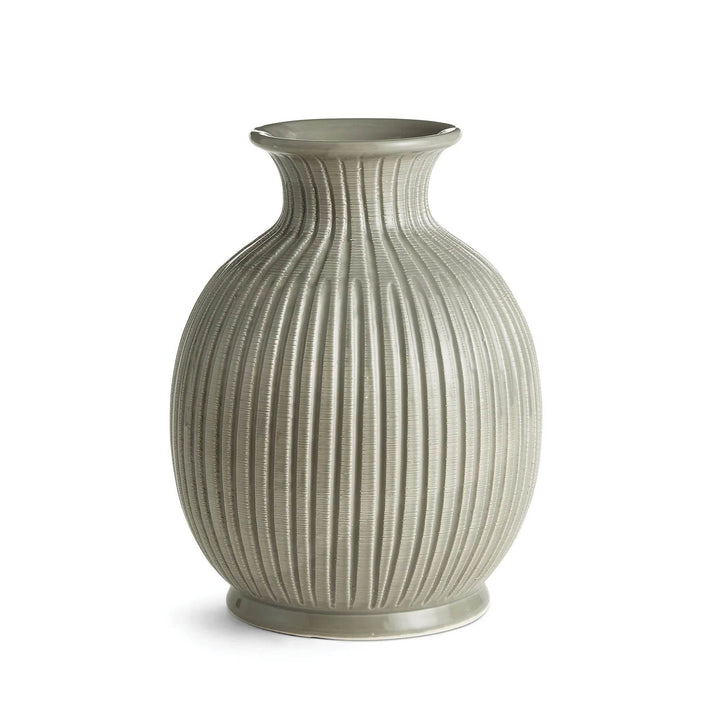 Decorative vase with ribbed texture on a white background