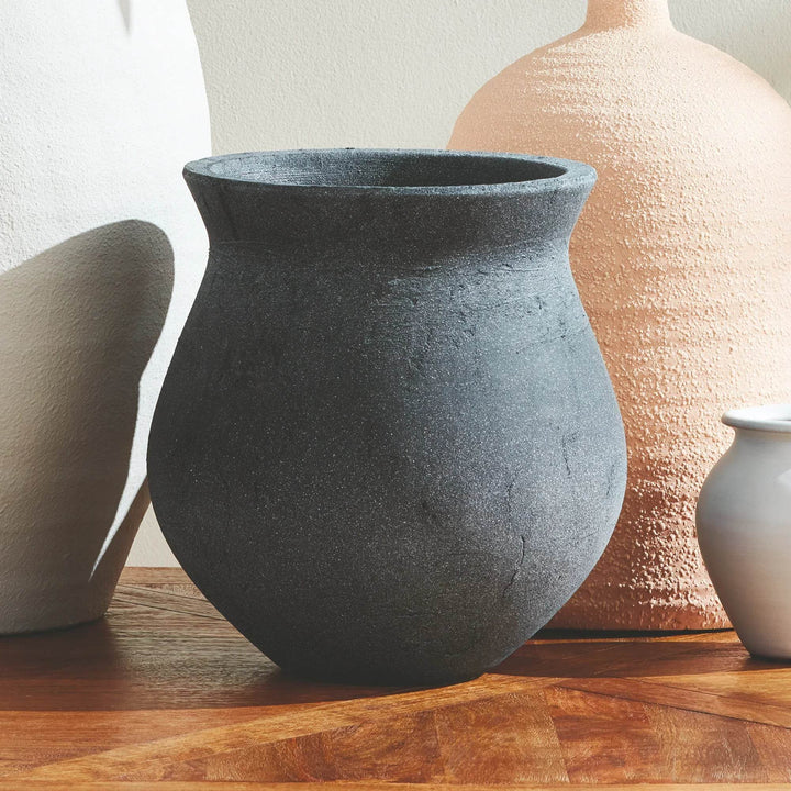 Rustic Terracotta Vase with Aged Finish on the Table