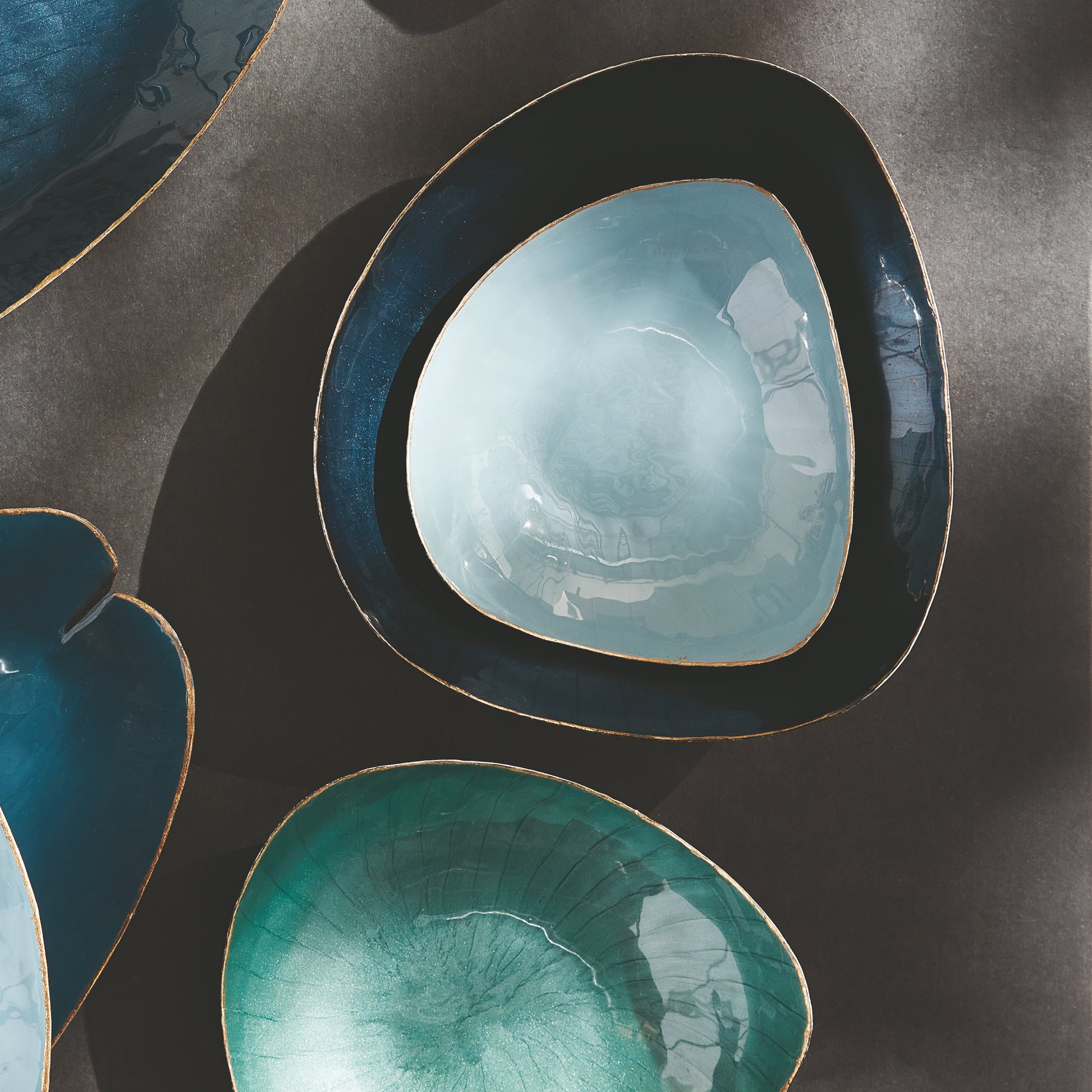 Crafted with exquisite attention to detail, these delightful coastal themed bowls infuse both sophistication and vibrancy into any setting. The gold edge embellishment and coordinating soft tones of green make them ideal for organizing small essentials while elevating the aesthetic of your home. Whether on your kitchen island, side table, or ottoman, these versatile bowls effortlessly enhance the beauty and functionality of any space.