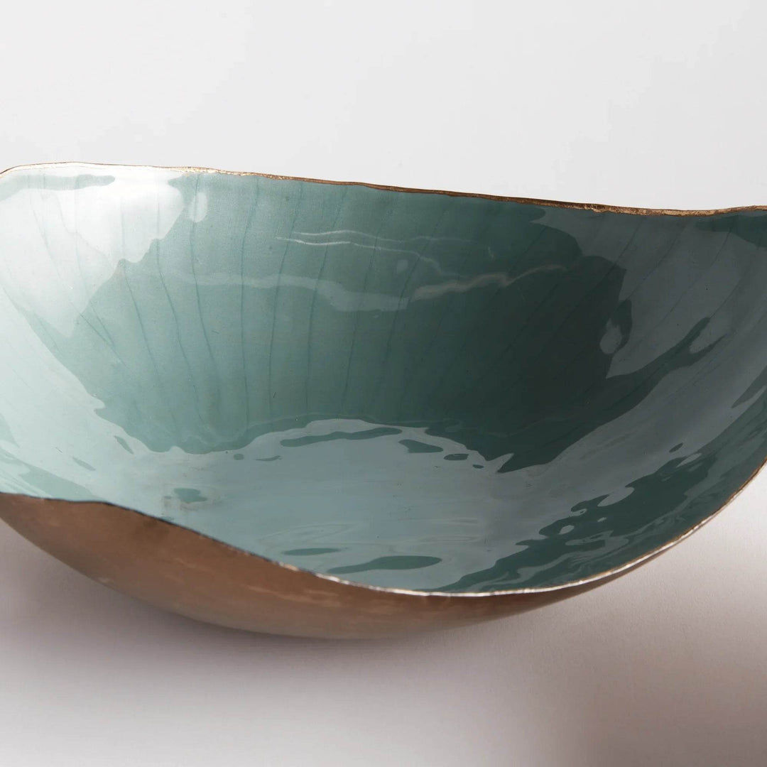Crafted with exquisite attention to detail, these delightful coastal themed bowls infuse both sophistication and vibrancy into any setting. The gold edge embellishment and coordinating soft tones of green make them ideal for organizing small essentials while elevating the aesthetic of your home. Whether on your kitchen island, side table, or ottoman, these versatile bowls effortlessly enhance the beauty and functionality of any space.