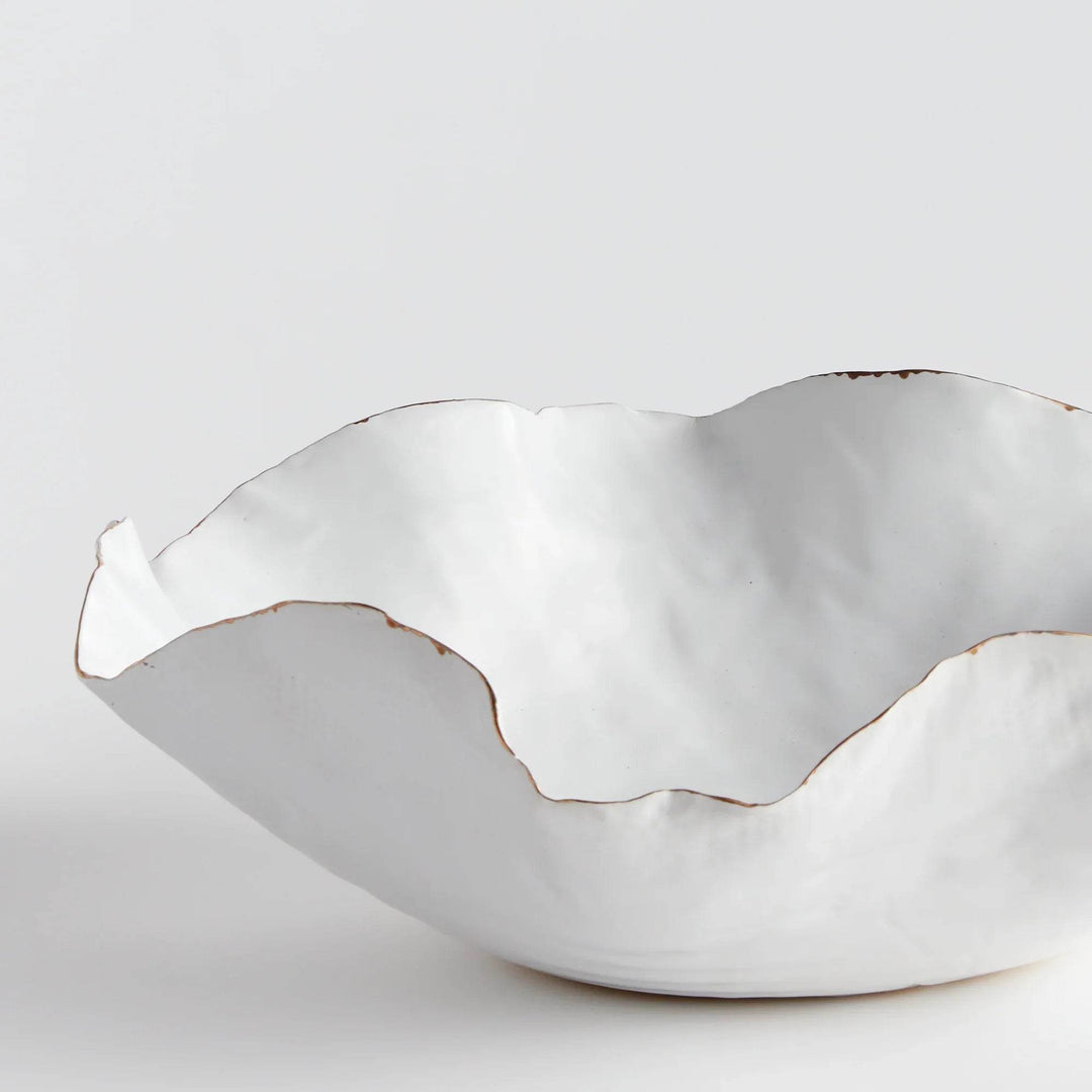 Carefully crafted with a seaside-inspired design, this large decorative tray boasts crimped edges and a natural form that is sure to make a statement in any room. Its hand-brushed gold tipped edges are electroplated for a glossy and long-lasting finish. Place it on a coffee table amongst stacked art books or on a side table for an eye-catching touch.
