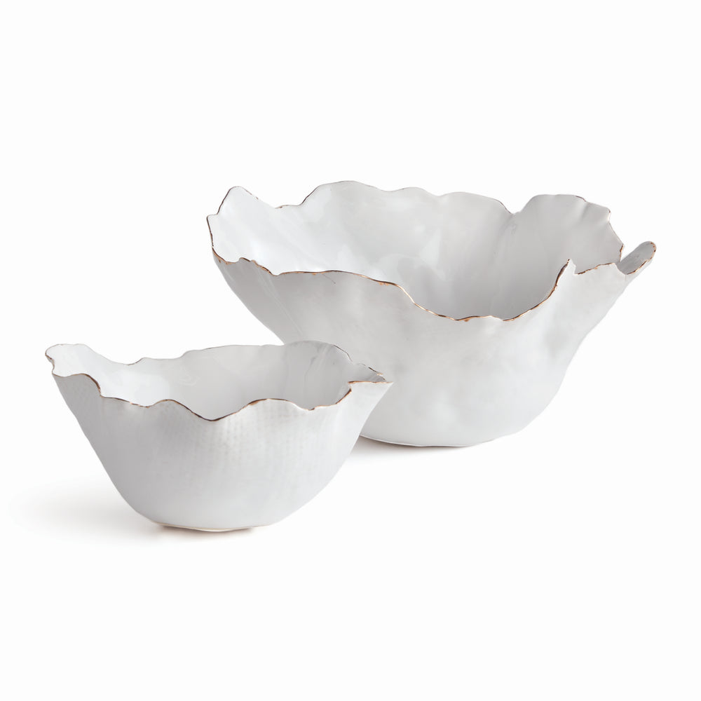 Add a touch of elegance to any room with these White Coastal Themed Decorative Bowls. The crimped edges and natural form create a stunning centerpiece, while the hand-brushed gold tipped edges add shine and durability thanks to the electroplating process. Whether displayed on a coffee table with art books or on a side table, these bowls are both functional and beautiful.