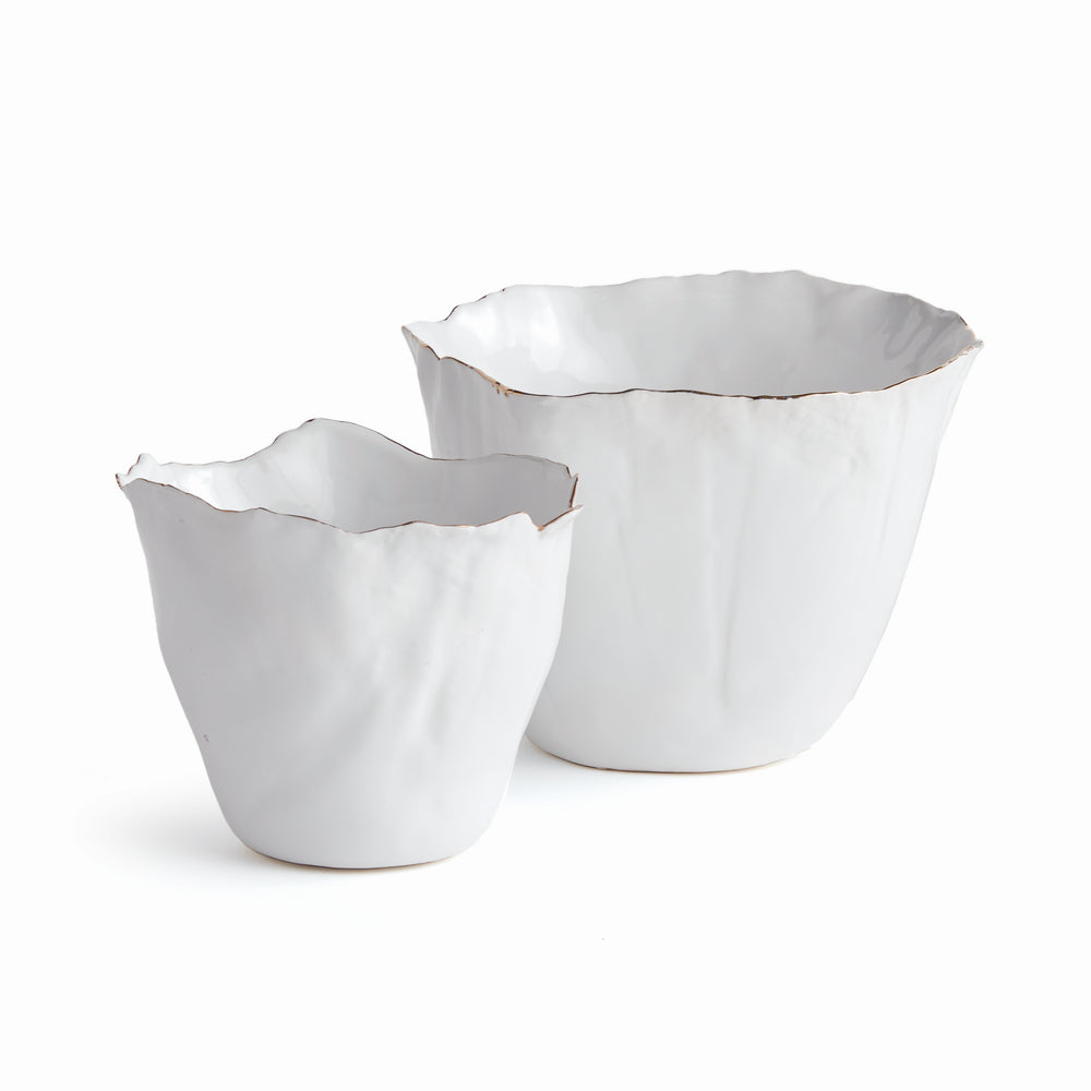 Our White Cachepots Planters feature crimped edges and a natural form, making them the perfect statement-making centerpiece. The hand-brushed gold tipped edges are electroplated for lasting shine and durability. Add your favorite orchid to elevate your home decor game.