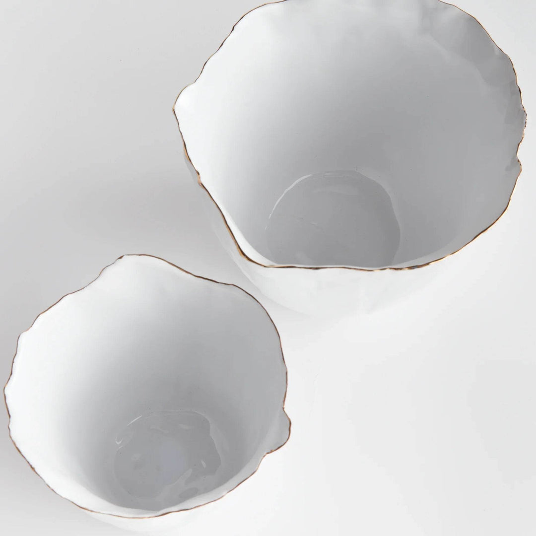 Our White Cachepots Planters feature crimped edges and a natural form, making them the perfect statement-making centerpiece. The hand-brushed gold tipped edges are electroplated for lasting shine and durability. Add your favorite orchid to elevate your home decor game.