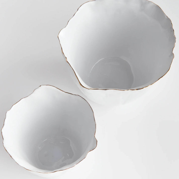 Our White Cachepots Planters feature crimped edges and a natural form, making them the perfect statement-making centerpiece. The hand-brushed gold tipped edges are electroplated for lasting shine and durability. Add your favorite orchid to elevate your home decor game.