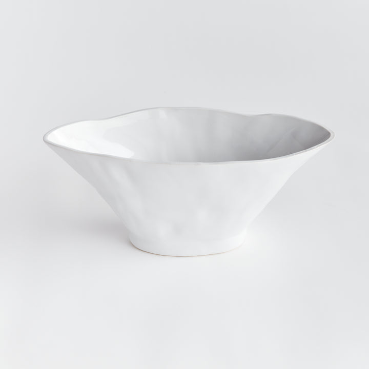 Enhance any space with the sleek and versatile design of the Coastal White Oval Vase Large. With its sculptural form and slim profile, it's perfect for narrow consoles or mantles. Add a faux stem or a few decorative orbs for a sophisticated touch.