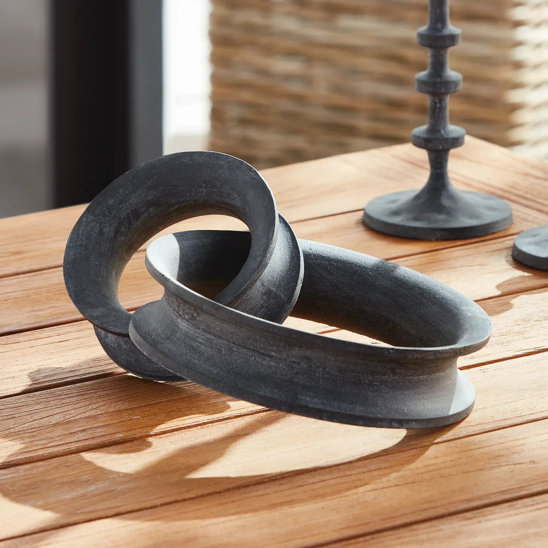 Decorative metal rings on a wooden surface