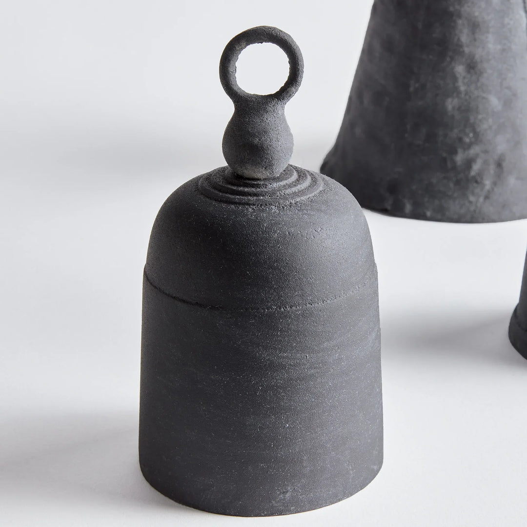 Black iron bells on a white background