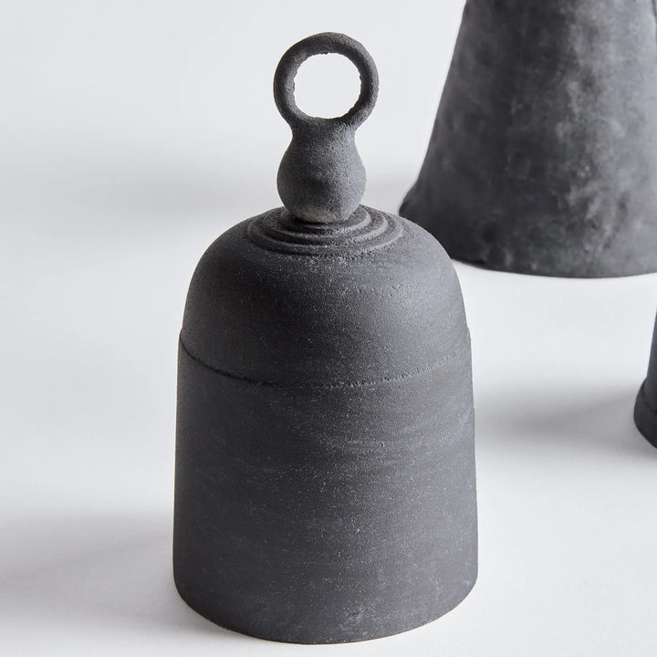 Black iron bells on a white background