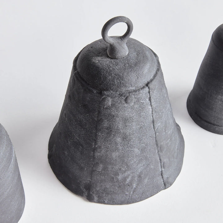 Black iron bell on a white background