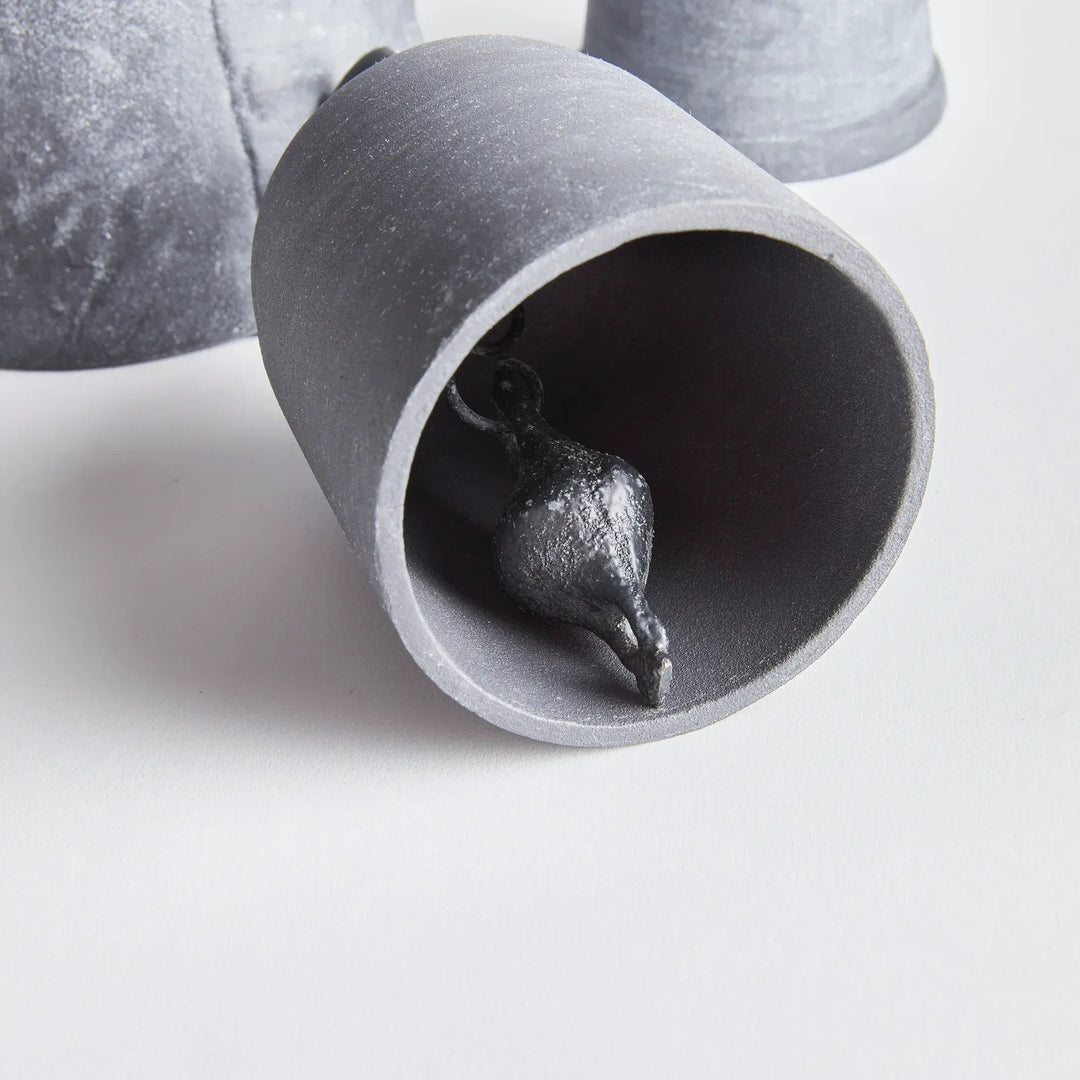Metallic rustic bell on a white background