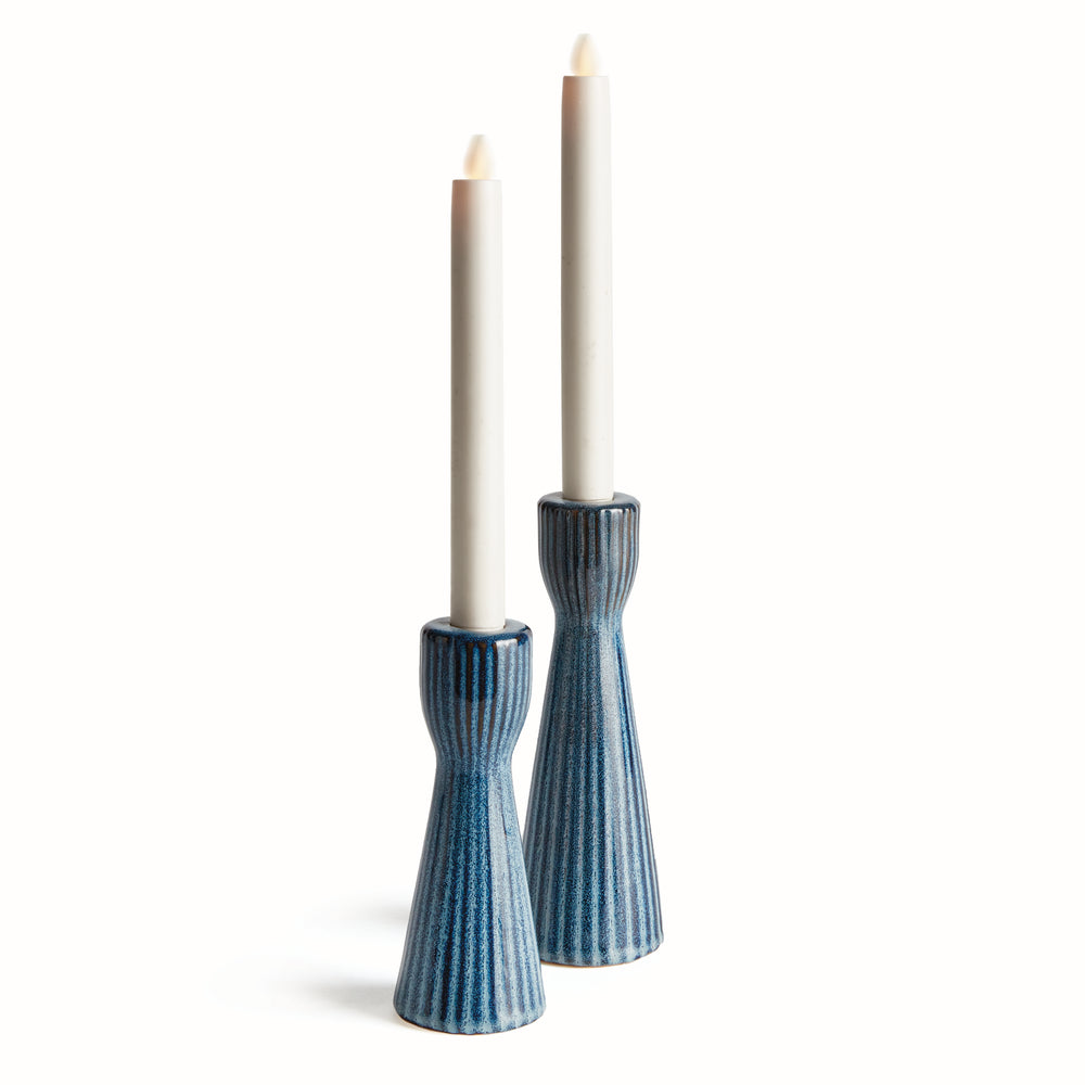Handcrafted blue ceramic candle holders on white background – size comparison