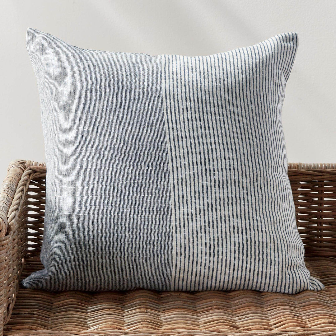 Side view of 24-inch navy and ivory striped linen pillow showing textured weave and piping


