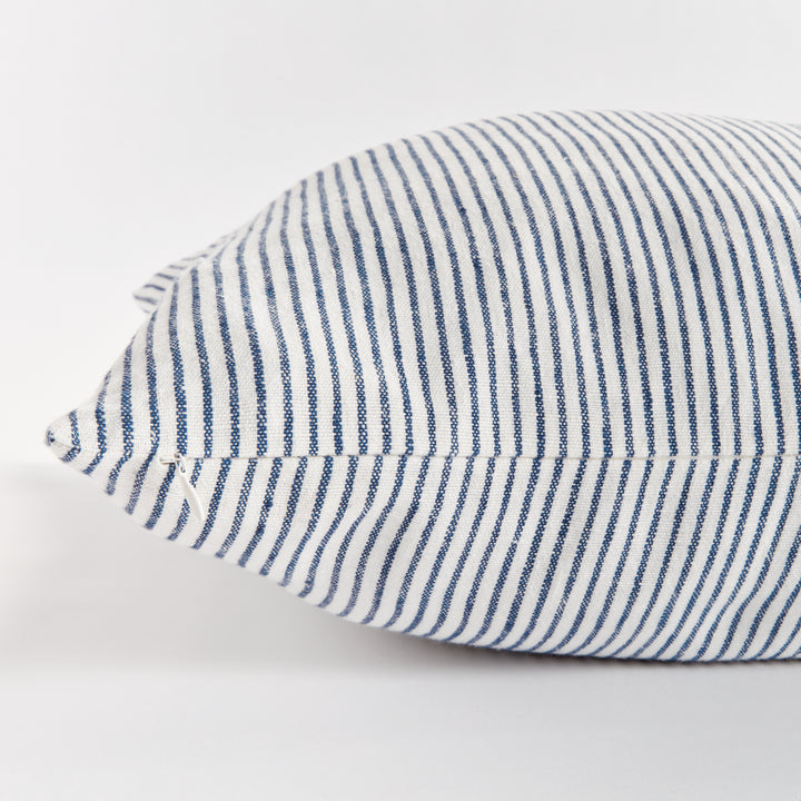 24x24 striped linen pillow placed with casual decor in modern interior setting


