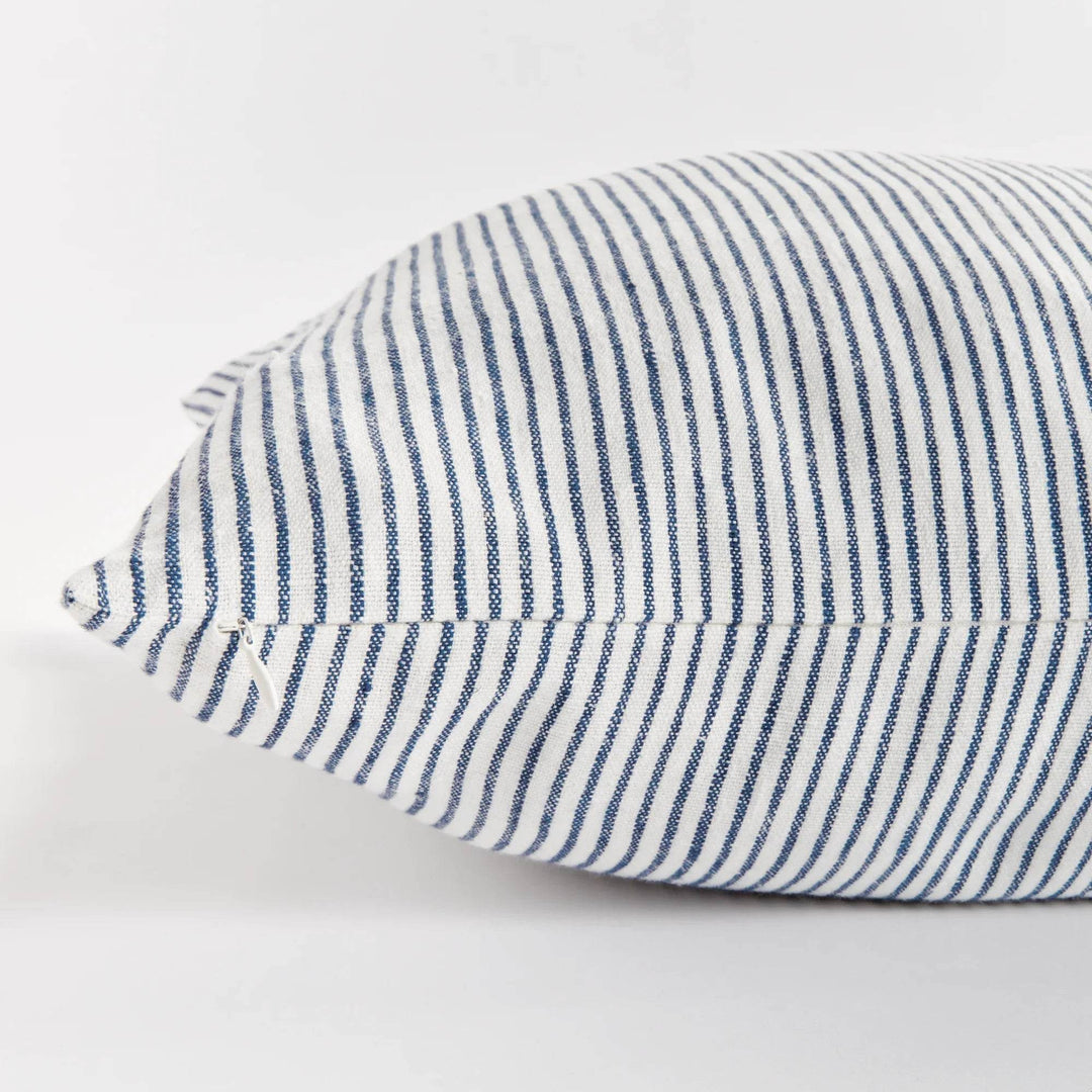 24x24 striped linen pillow placed with casual decor in modern interior setting


