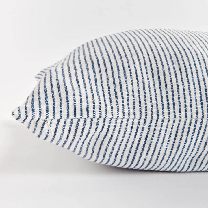 24x24 striped linen pillow placed with casual decor in modern interior setting


