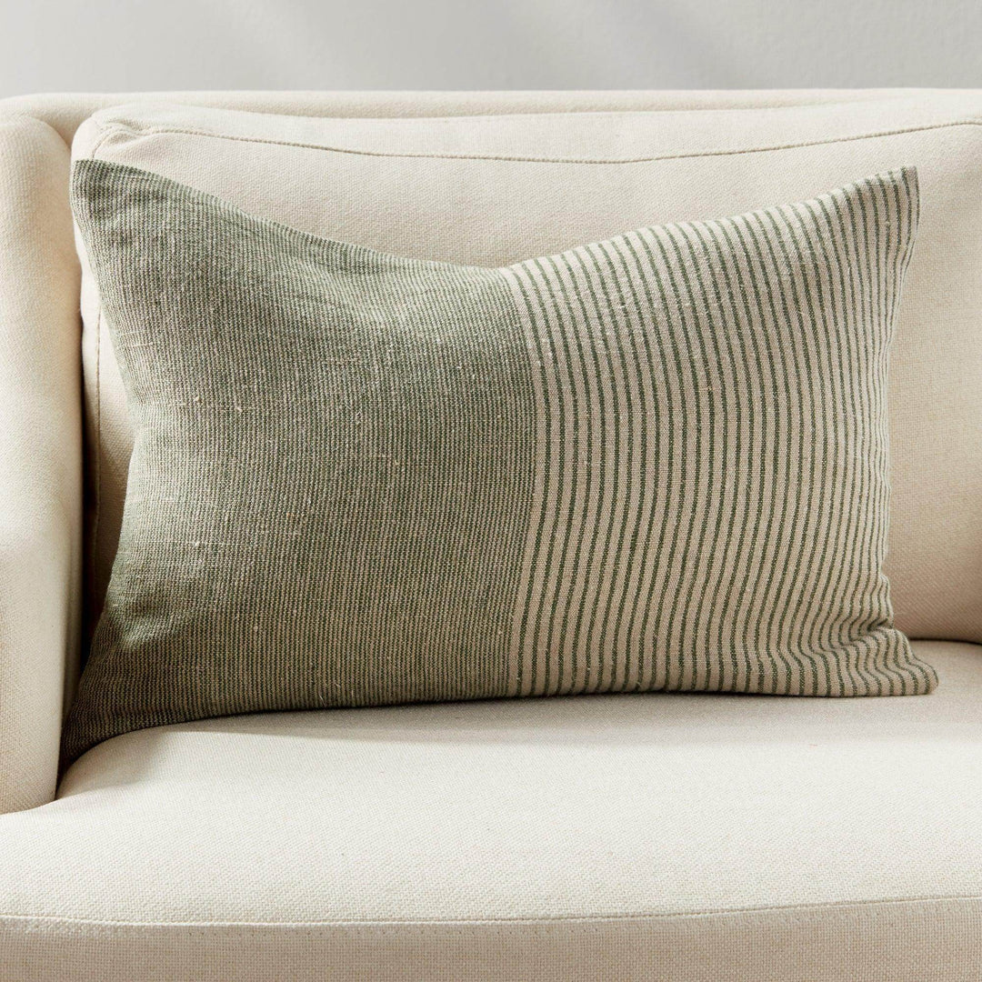 Pinstripe lumbar pillow styled with tonal solids and subtle stripes, showcasing Delamere’s curated mix-and-match aesthetic for elevated, layered design.

