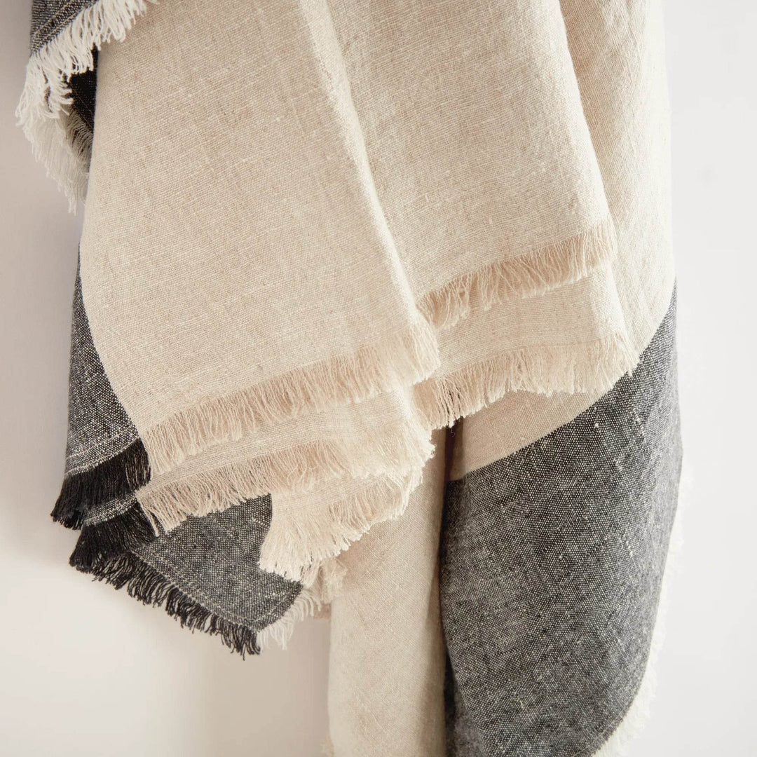 Macro detail of charcoal stripe pattern on natural flax linen fabric


