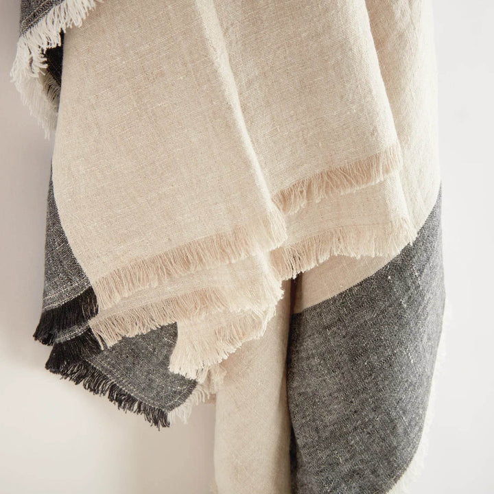 Macro detail of charcoal stripe pattern on natural flax linen fabric


