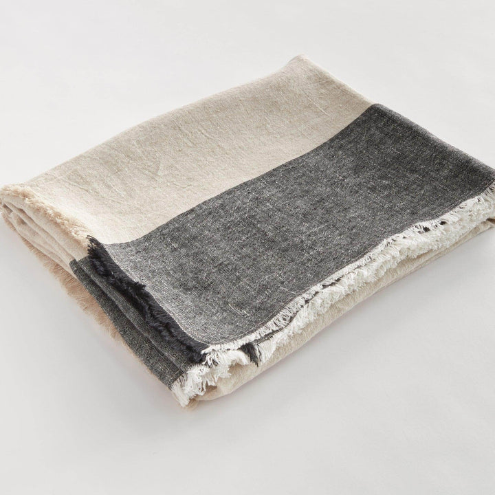 Flax and charcoal striped European linen throw blanket folded neatly, 60x50 inches

