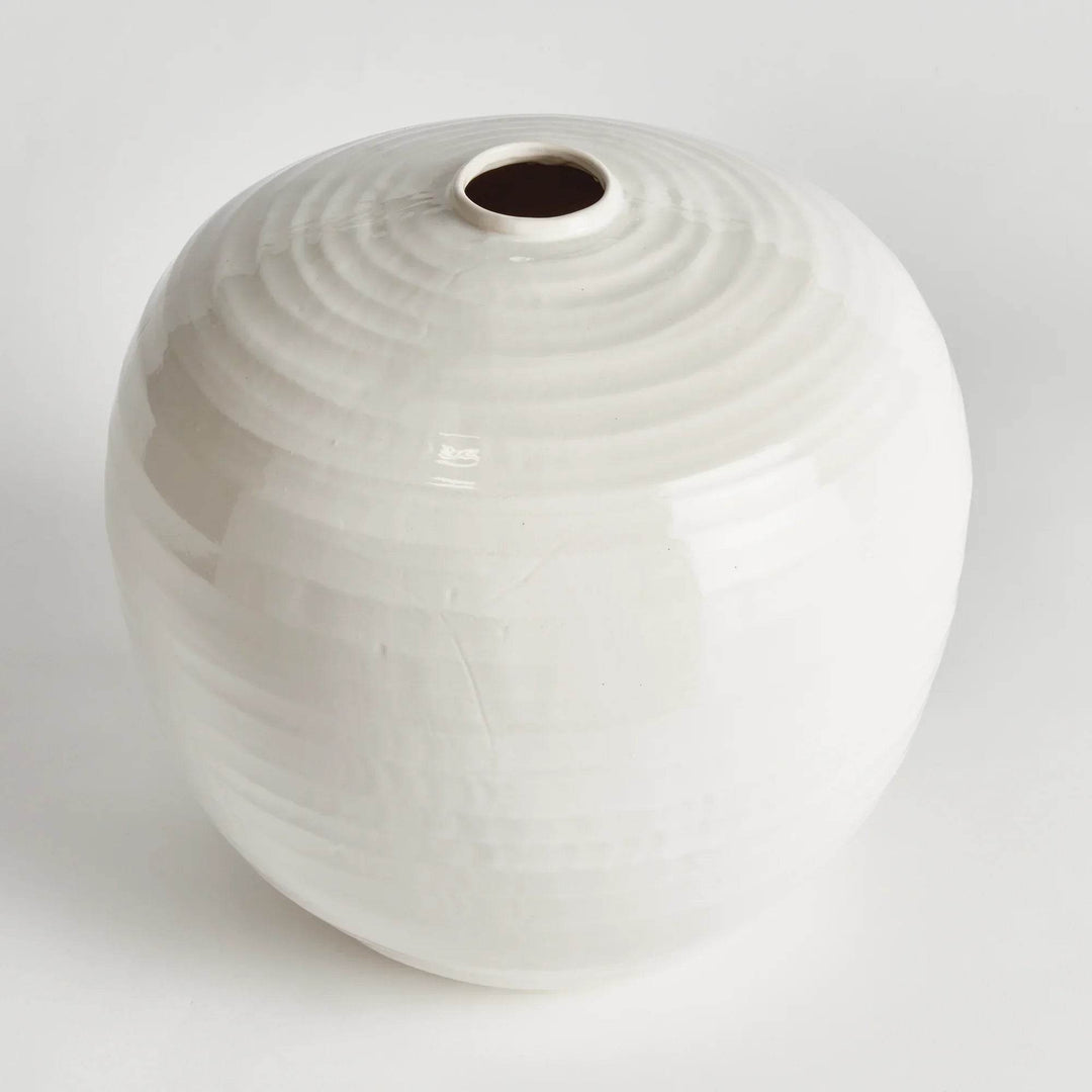 Large oatmeal stoneware vase with a rounded silhouette and reactive glaze finish, shown in soft studio lighting on white background.