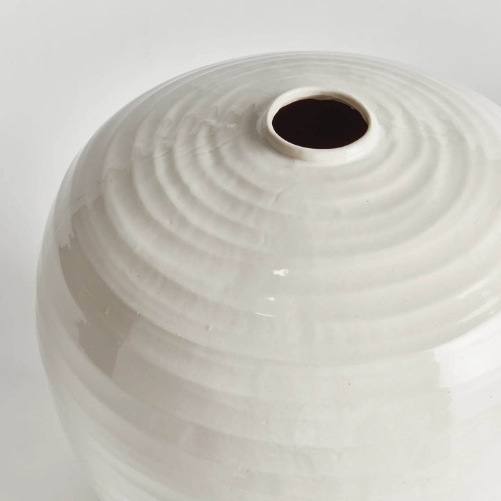 Detail shot of oatmeal reactive glaze on large stoneware vase, showing handmade ridges and tonal variation in ceramic finish.