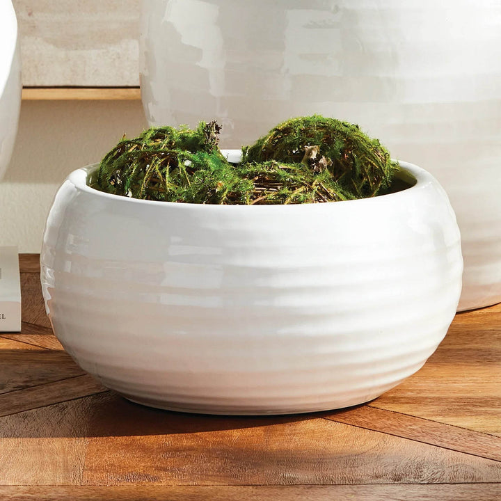 Close-up of oatmeal reactive glaze and artisan texture on handcrafted stoneware bowl, highlighting organic lines with green filler