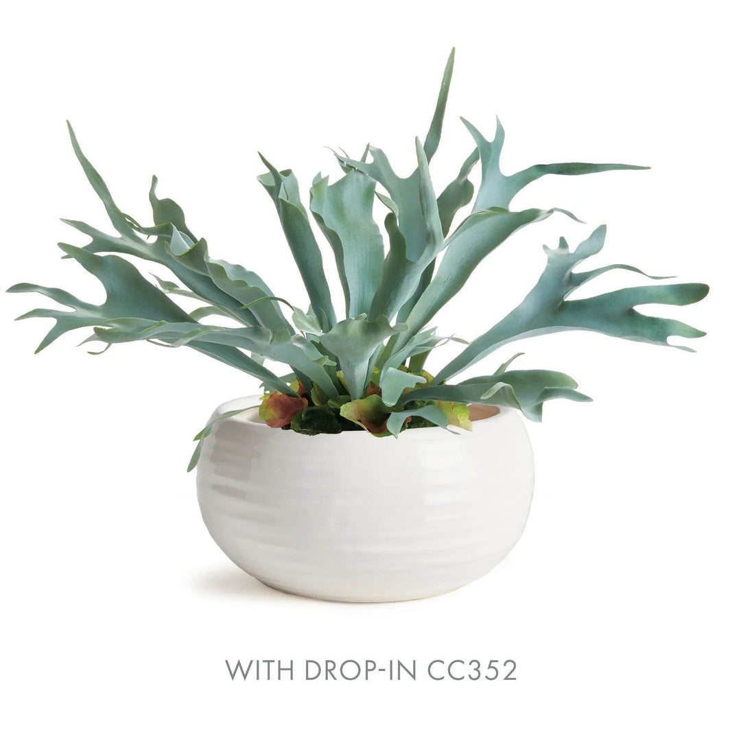 Close-up of oatmeal reactive glaze and artisan texture on handcrafted stoneware bowl, highlighting organic lines