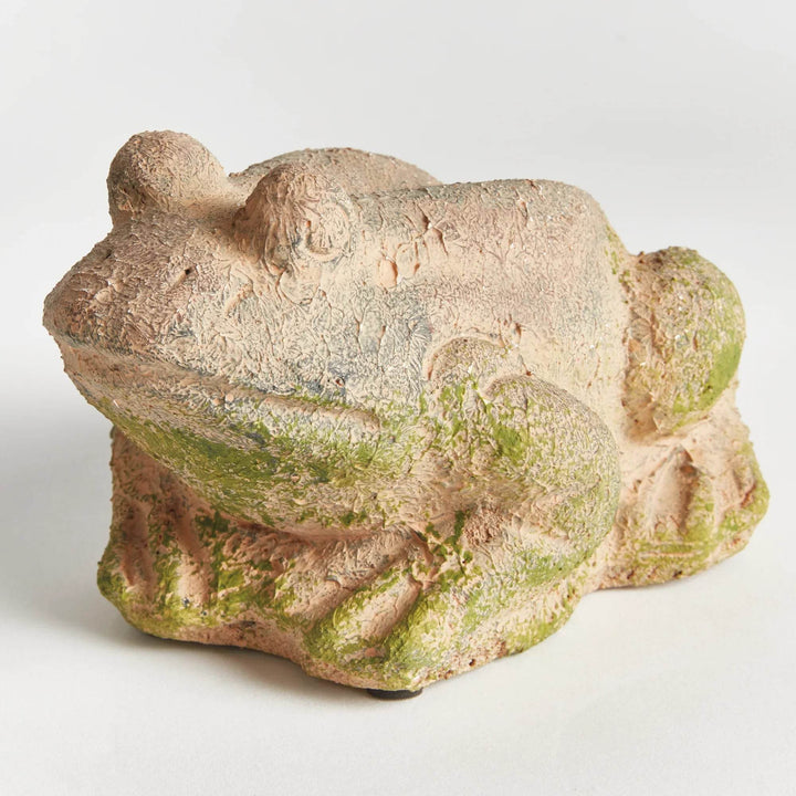 Front-facing image of moss terracotta frog sculpture, positioned on neutral tile for a clean, natural garden presentation.

