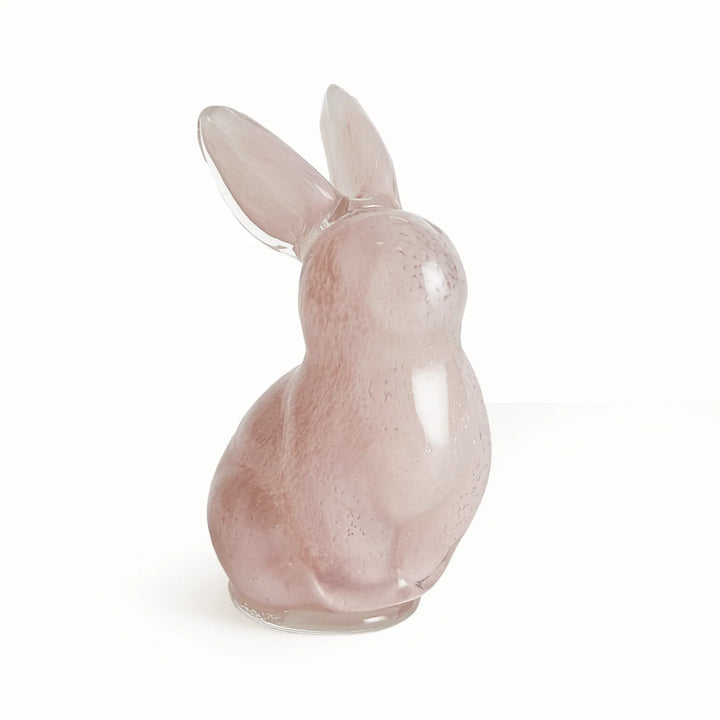 Pink rabbit-shaped sculpture on a white background
