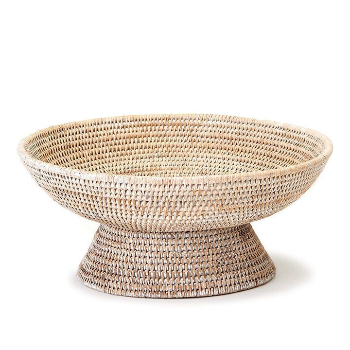 Whitewash woven rattan pedestal offering bowl showing the pale woven finish, broad round rim and its matching raised base, Transitional