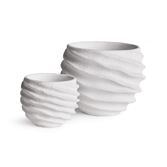 A graphic pattern of concentric circles make this set of pots very mod indeed. A thick white glaze adds a fresh, light feel. Add your favorite blooms or lush greens and enhance any contemporary space.