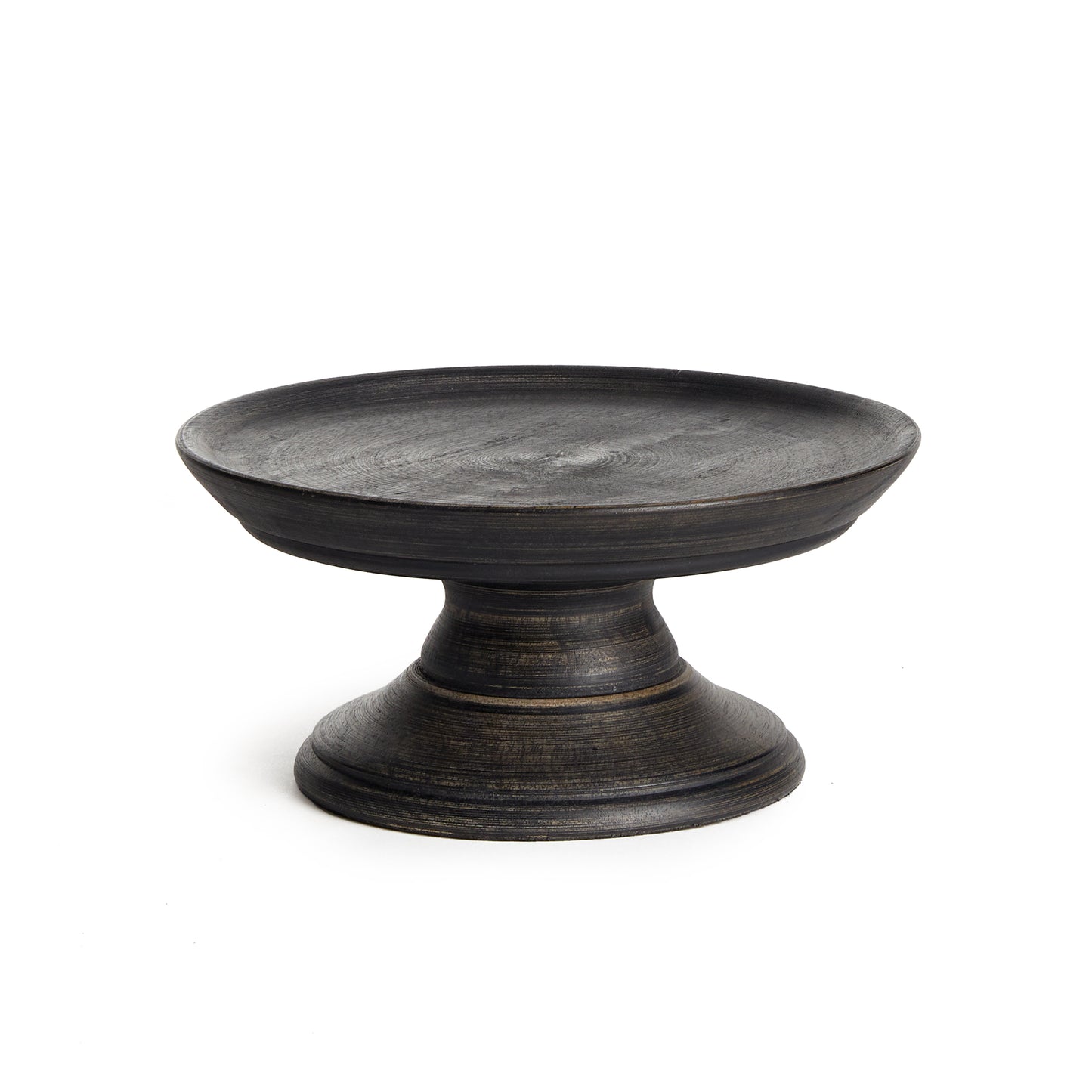 Looking to elevate your display? Made out of turned mango wood, and finished in a dark, matte wash this traditional stand is a work of art. Use on the kitchen island, or in the family room to create some variation in height and added interest to your accents.