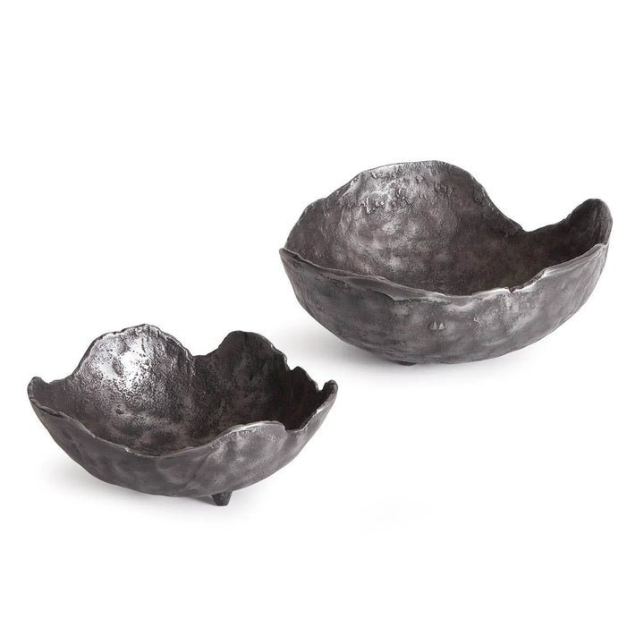 Two metallic bowls with a textured surface on a white background