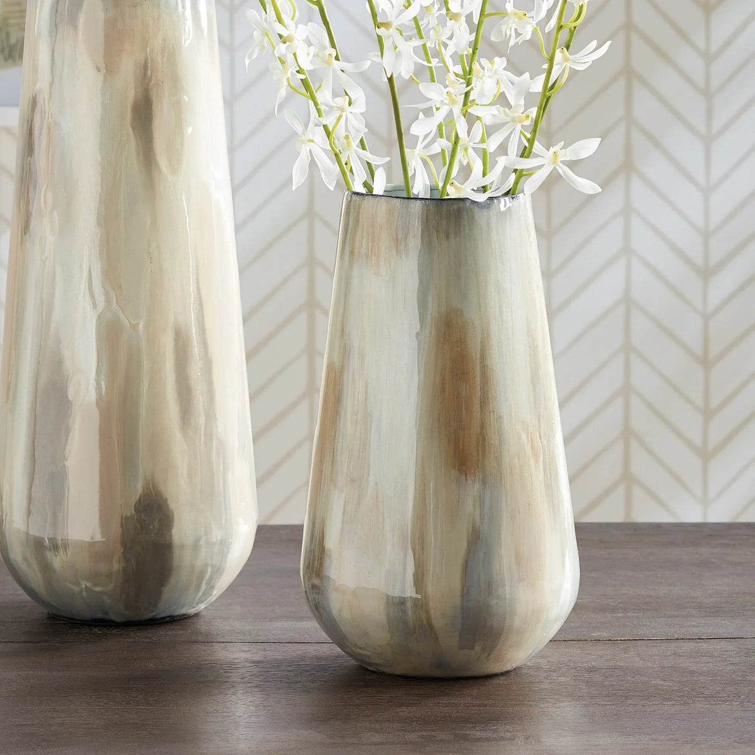 Using enameled iron in an innovative manner, these delicately crafted vases are hand-painted, each one featuring a charming tone-on-tone design. This technique produces a lovely light and creamy effect, making for a distinctive addition to any space. Crafted with expertise, Almeta White Pearl Vase Small stands out with its innovatively crafted enameled iron and charming tone-on-tone design. This unique technique produces an elegant, light and creamy effect that adds a distinctive touch to any room.