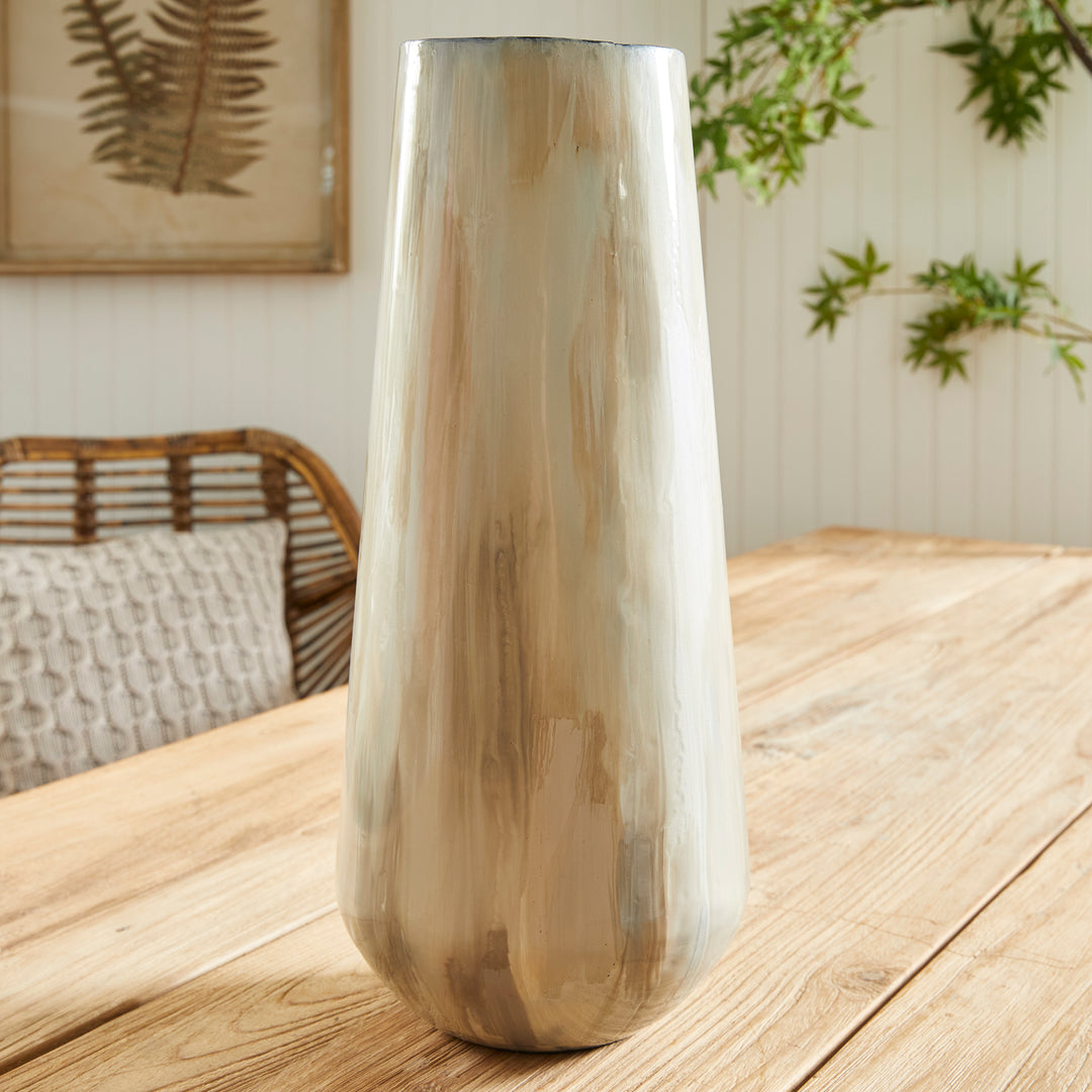 Experience the advantages of enameled iron with Almeta White Pearl Vase Large. These lightweight beauties are hand-painted, showcasing a stunning and elegant tone-on-tone design. Each vase is crafted with expert precision, ensuring a light and creamy appearance. Find beauty in simplicity with Almeta White Pearl Vase Large. Made of enameled iron, these hand-painted vases boast a stunning tone-on-tone design with expertly crafted precision. Enjoy lightweight and creamy perfection with every vase.