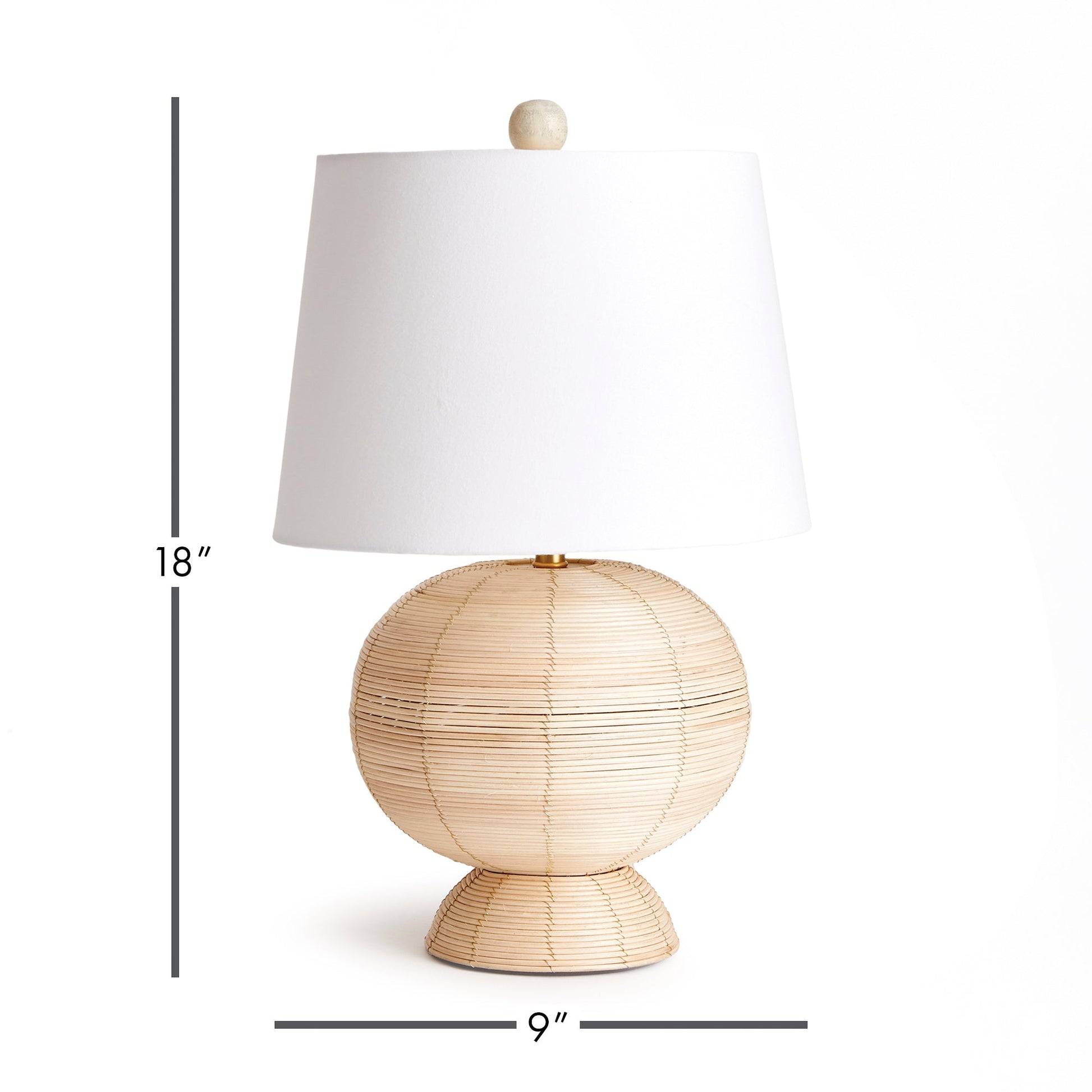 Handcrafted from whitewashed cane rattan, each hourglass table lamp features a distinctive color variation, making it truly one-of-a-kind. Its wide cylindrical white shade adds the perfect touch to any bedroom, living room, or study, solidifying its status as a timeless accent piece.