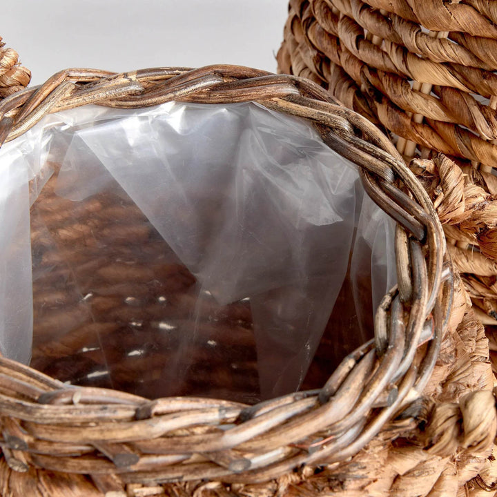 Top view of abaca basket planter showing woven rim detail and clear plastic liner for planting and surface protection - Modern Organic.