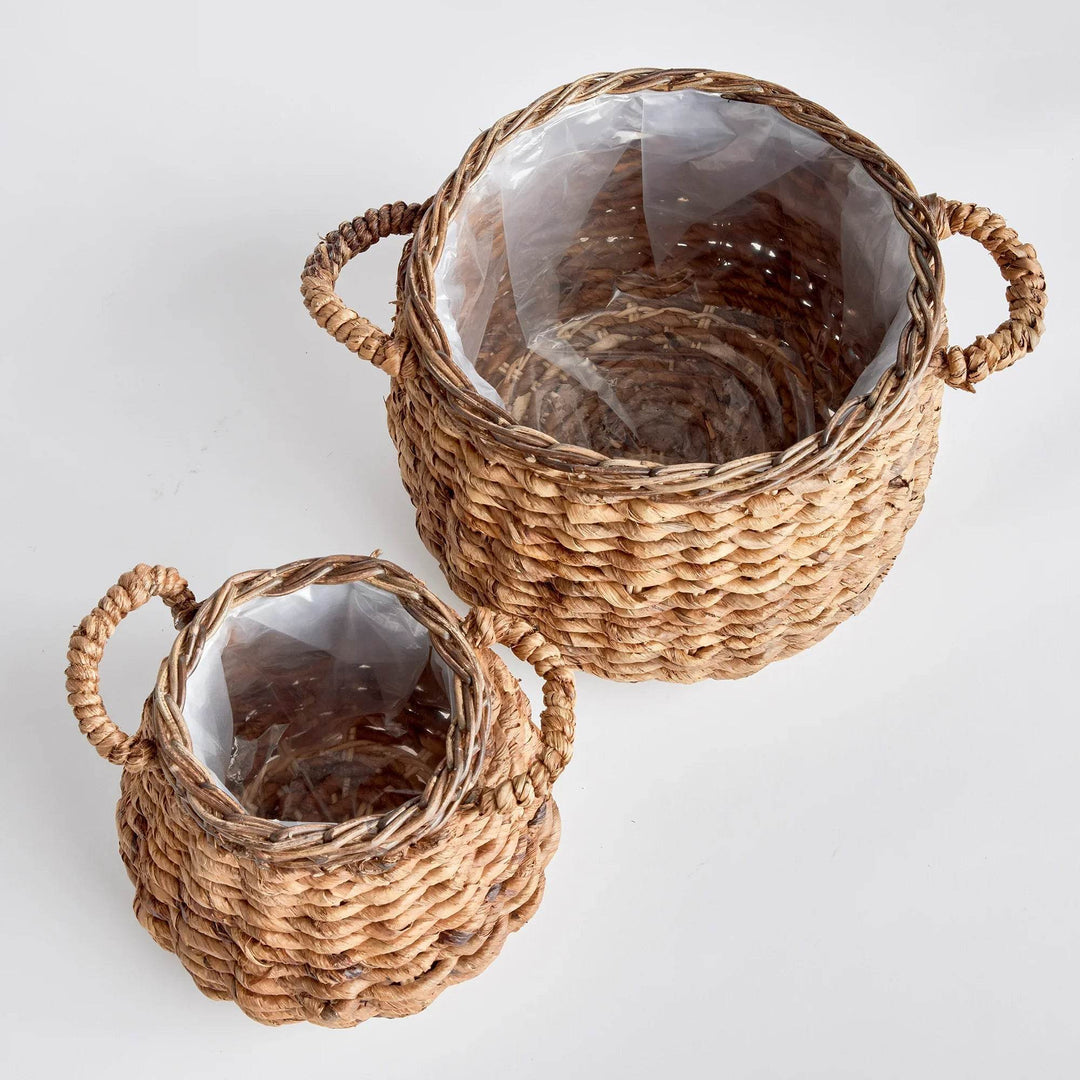 Set of two abaca basket planters with plastic liners, rounded woven construction and side handles for indoor plants - Modern Organic.
