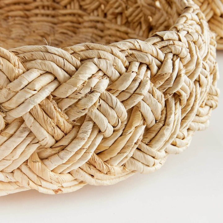Closeup of French braid weave on handwoven abaca basket, showing natural fiber texture and artisanal detail – Modern Farmhouse.