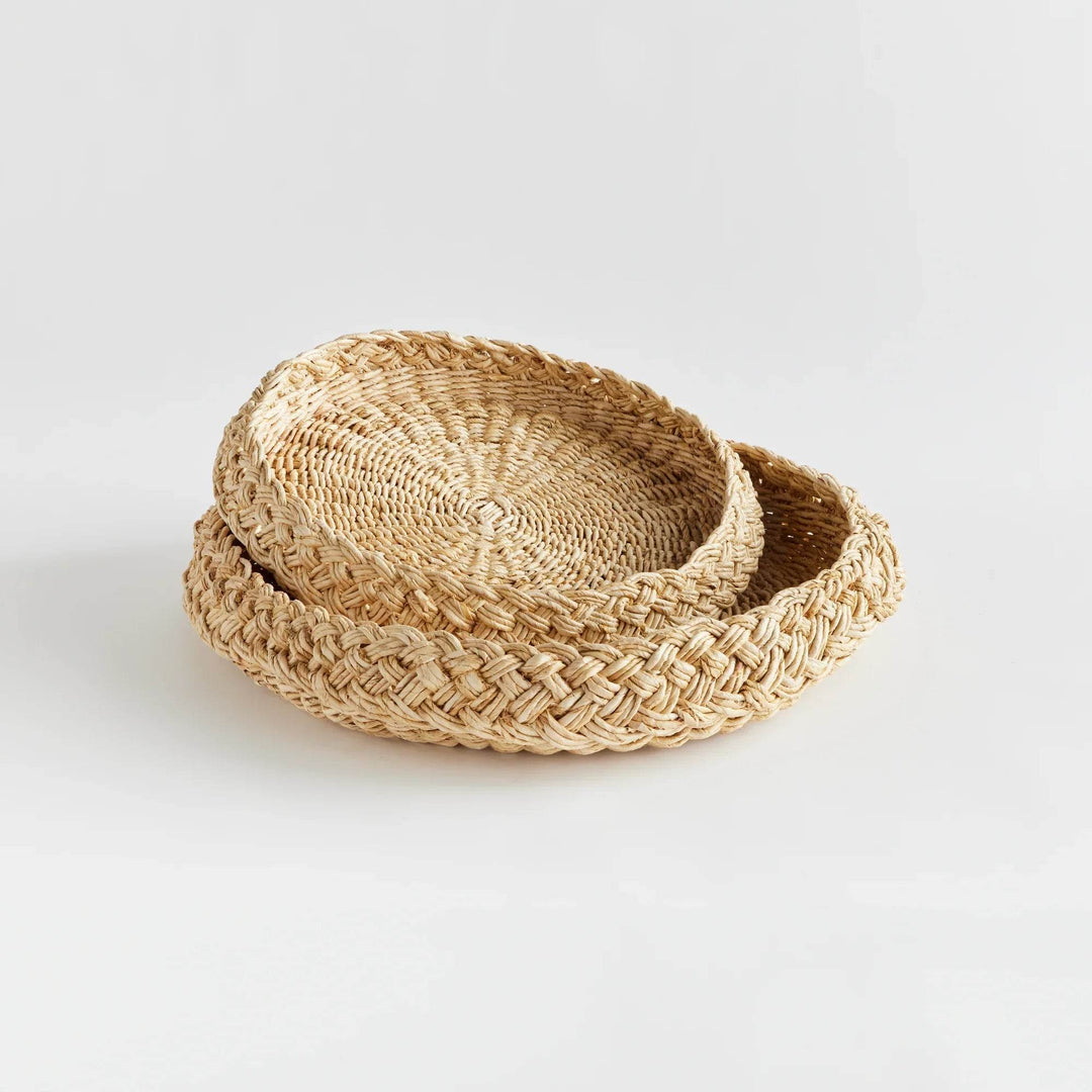 Side view of round abaca display trays, nested set of two showing low rim and tray profile in natural fiber – Coastal.