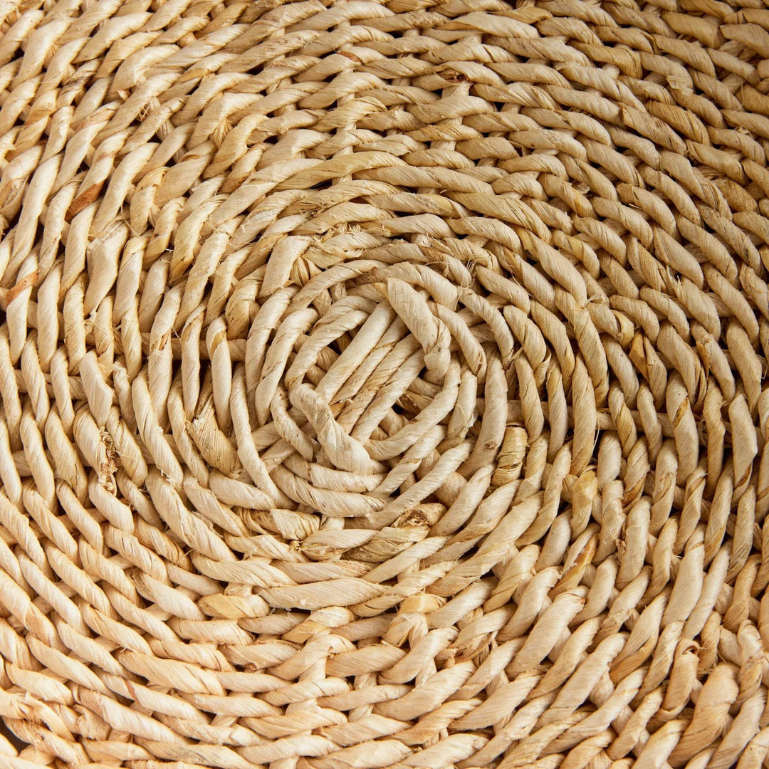 Closeup of spiral woven bottom on round abaca tray, natural fiber texture and tone variation – Coastal.