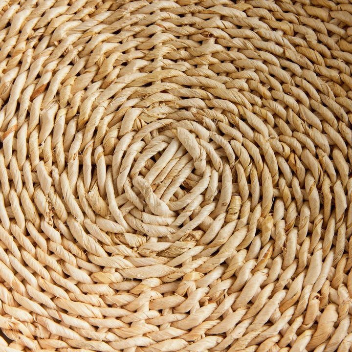 Closeup of spiral woven bottom on round abaca tray, natural fiber texture and tone variation – Coastal.