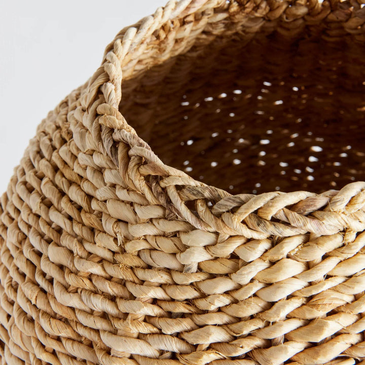 Close-up of abaca teardrop vase showing woven rim detail and interior weave pattern in natural tan finish – Boho