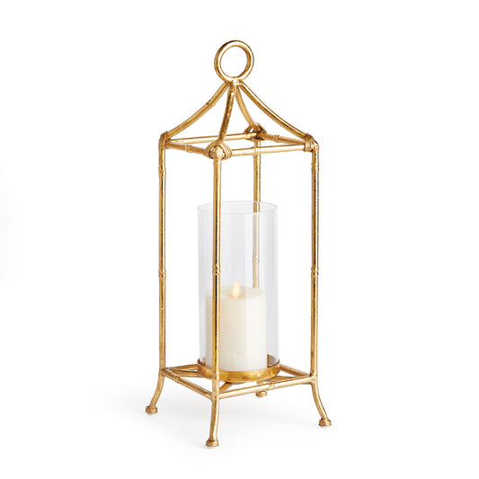 A contemporary take on chinoiserie style, this lantern is smooth and refined, it is scaled to work well in the smaller space. The antique gold finish and sleek glass cylinder add a sense of light and reflection.