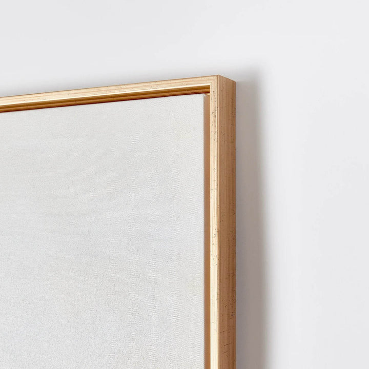 Corner detail of modern abstract canvas wall art with slim metallic gold frame finish – Modern Coastal