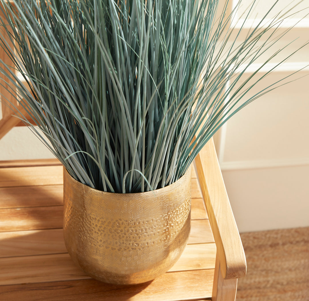 Made to look 100% realistic, this wispy blue oat grass is a natural touch. Drop in to your favorite pot or cachepot and add some coastal appeal to your space. Enhance your decor with natural, realistic botanicals. This blue oat grass adds a touch of coastal charm to any room.