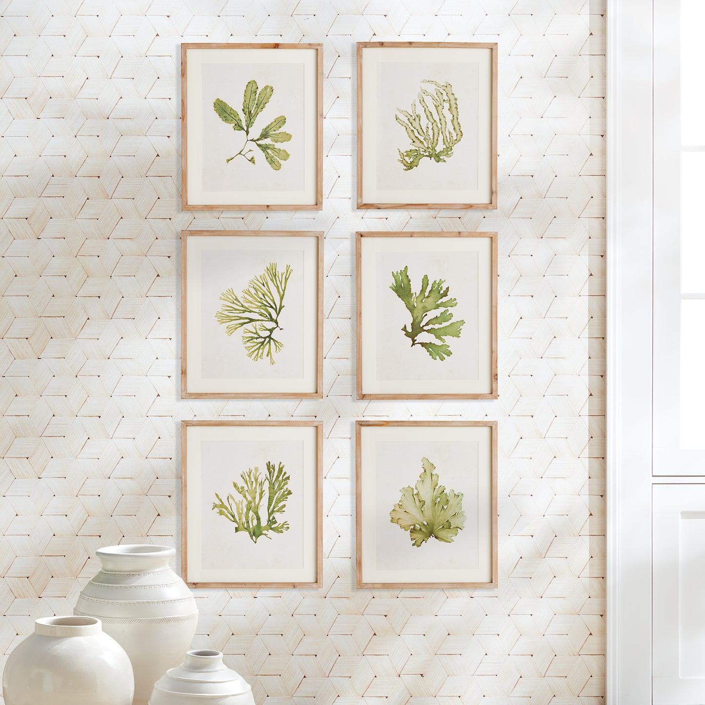 As refined in appearance as they are in size, these kelp wall prints embody the essence of sophisticated coastal living. With a delicate watercolor design and frames made of natural wood with a washed finish, these wall prints are perfect for any coastal themed home. 