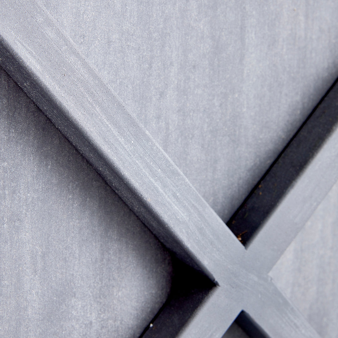 Close-up detail of aged zinc finish and iron X-frame construction on outdoor metal planter – Modern Farmhouse planter