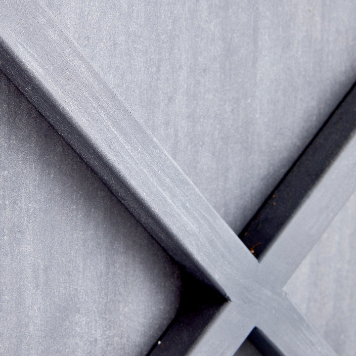 Close-up detail of aged zinc finish and iron X-frame construction on outdoor metal planter – Modern Farmhouse planter
